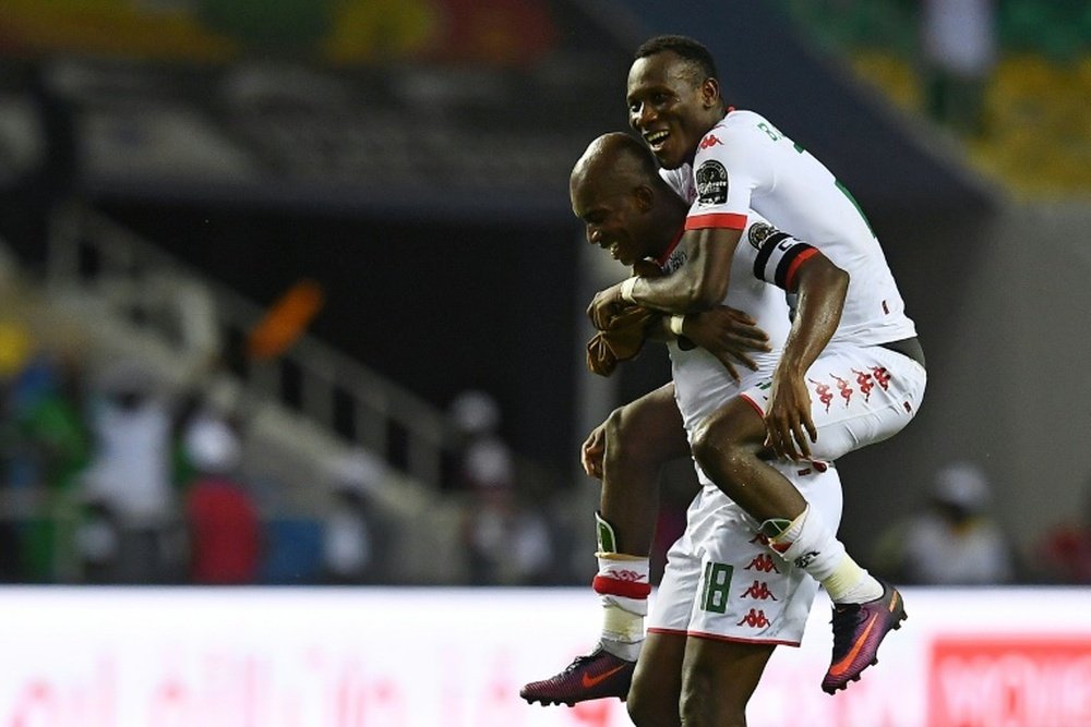 Burkina's Kabore and Cyrille Bayala celebrating a goal against Tunesia. AFP