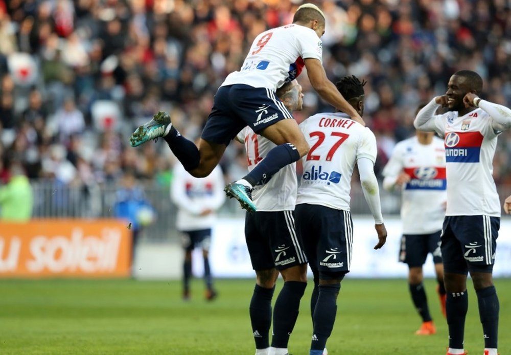 Lyon players celebrate a goal against Nice. AFP