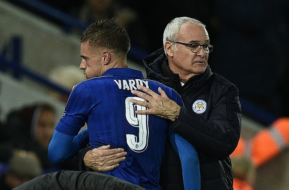 Ranieri embraces Jamie Vardy when leaving the field during a Champions League fixture. AFP