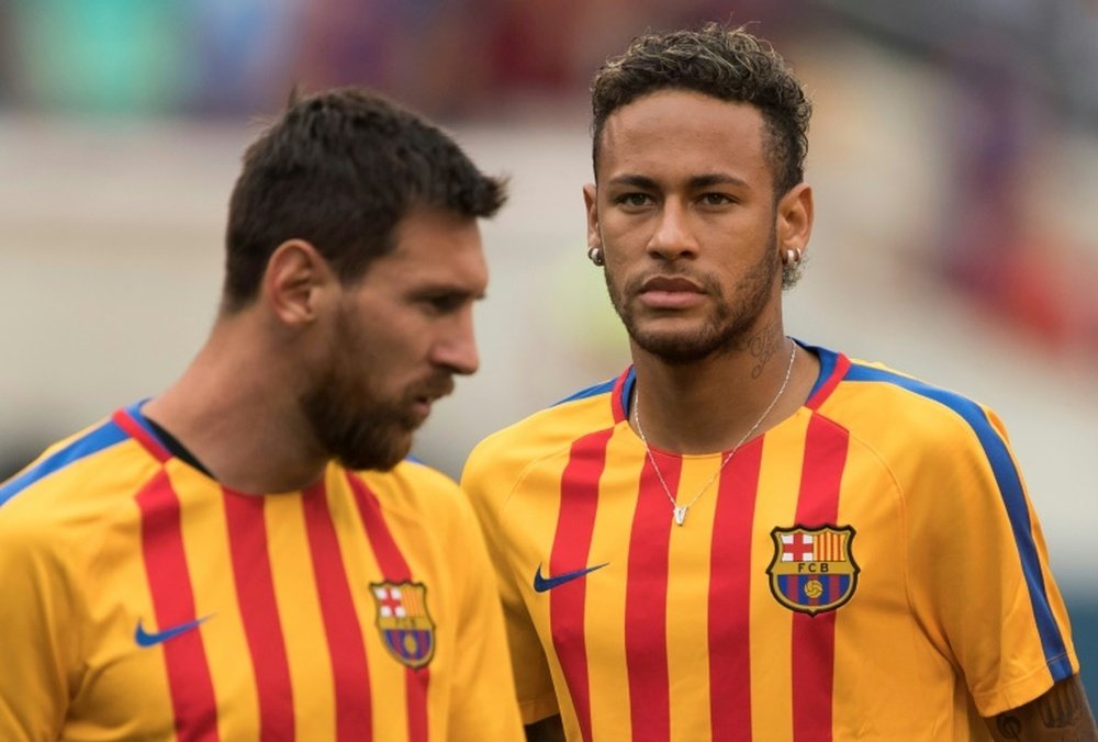 Ronaldinho would like to see Neymar back at Barcelona with Messi. AFP