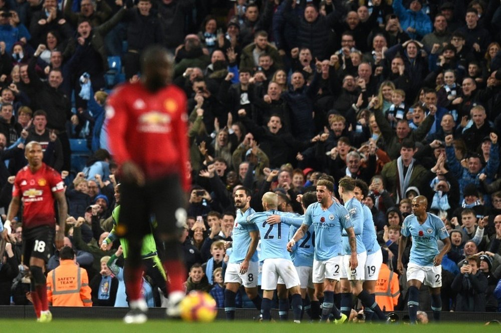 Pourquoi les supporters de Man United veulent que City gagne le titre ? AFP
