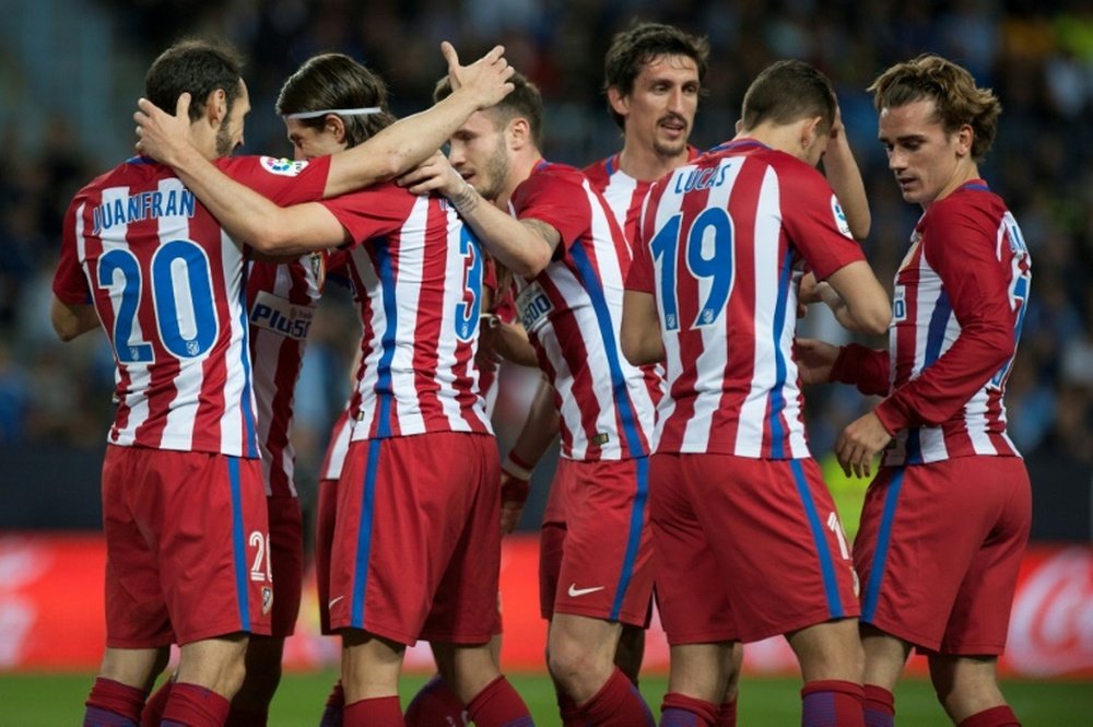 Les joueurs de l'Atletico Madrid se congratulent après un but contre Malaga. AFP