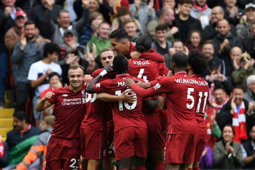 Liverpool players celebrate during victory over Southampton. AFP