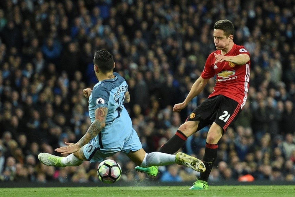 Herrera thinks Manchester City can still be caught at the top of the league. AFP