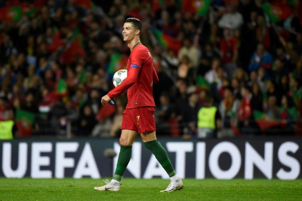 La star du Portugal Cristiano Ronaldo heureux. AFP