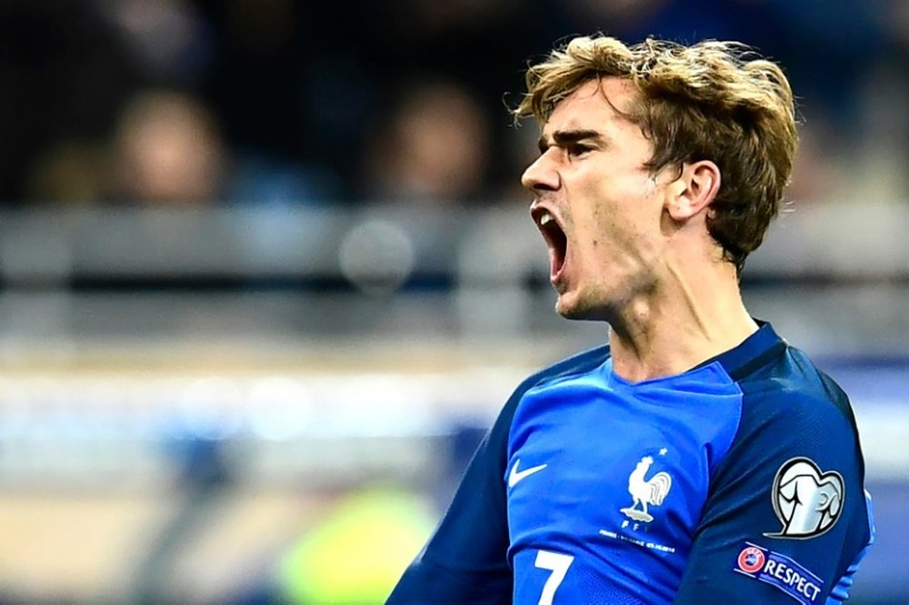 Griezmann celebrates scoring for France. AFP