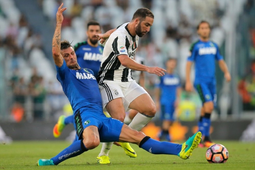 Francesco Acerbi, seen here tackling Gonzalo Higuain. AFP