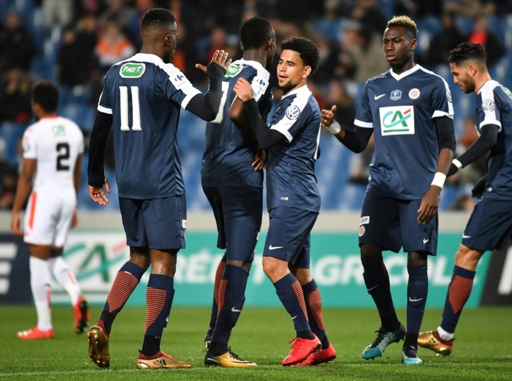 Les joueurs de Montpellier se congratulent après un but face à Lorient. AFP