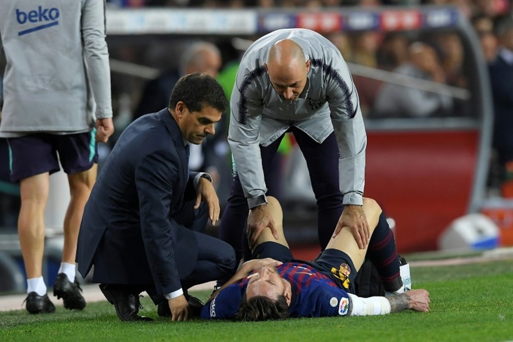 Messi receives treatment. AFP