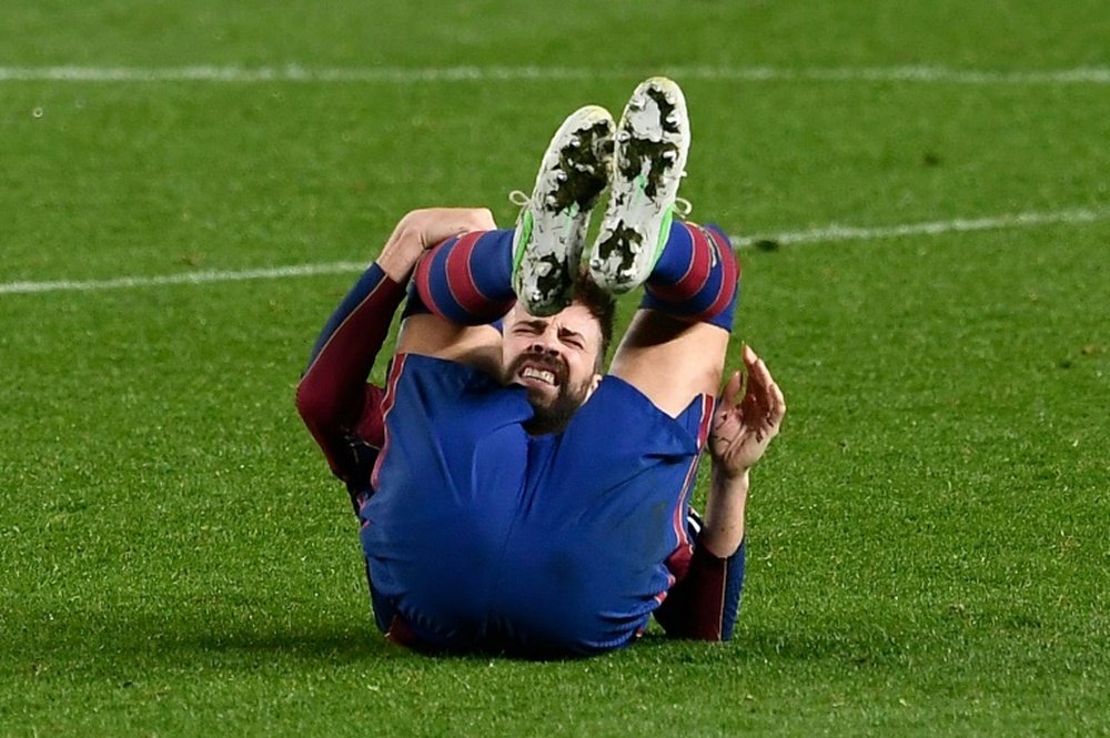 Gerard Piqué s'est blessé pendant la demi-finale de Coupe du Roi contre Séville. AFP