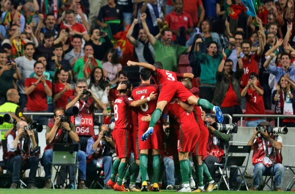 Les Portugais iront au Mondial après leur succès sur la Suisse, ici le 2e but signé Joaõ Mario. AFP