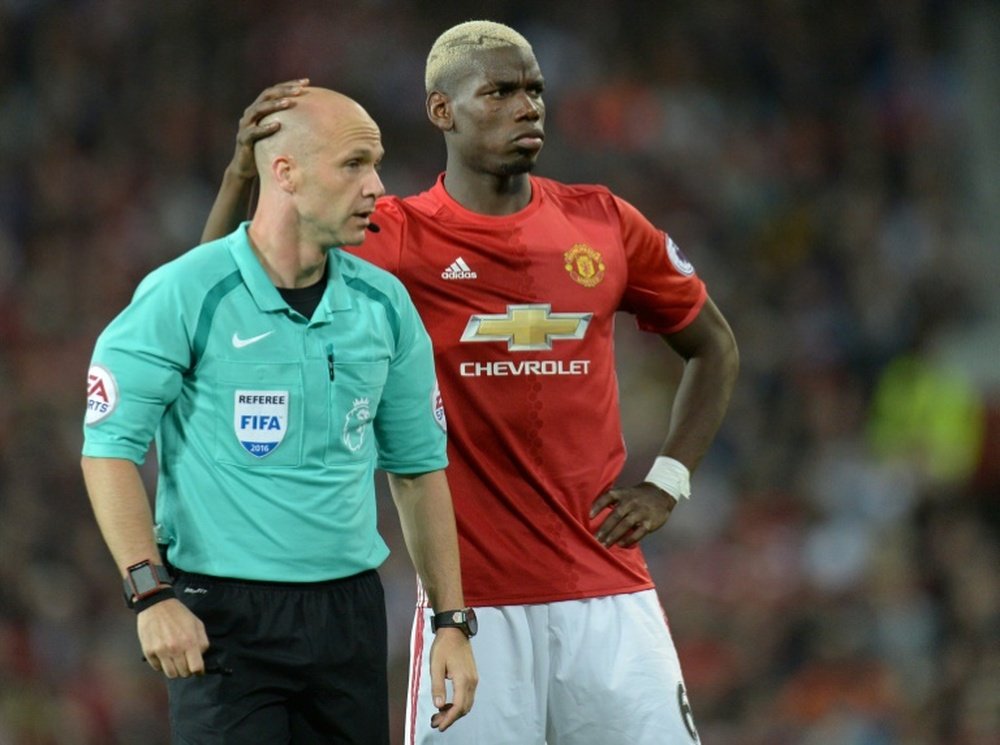 Taylor's appointment for the Manchester Derby has been defended by the Premier League. AFP