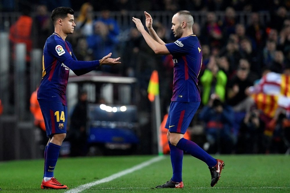 Coutinho se voit jouer aux côtés d'Iniesta. AFP