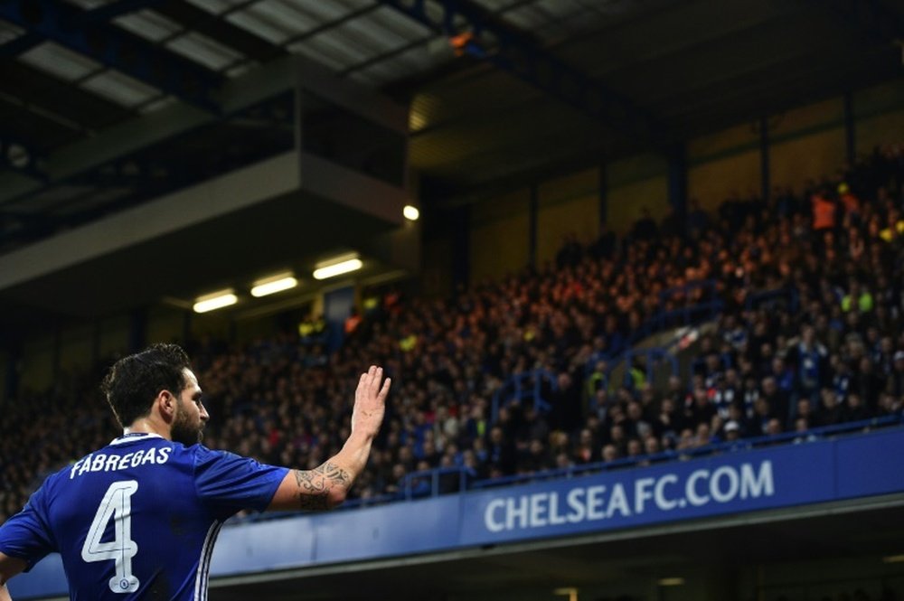 Cesc Fabregas saluting Chelsea fans at Stamford Bridge. AFP