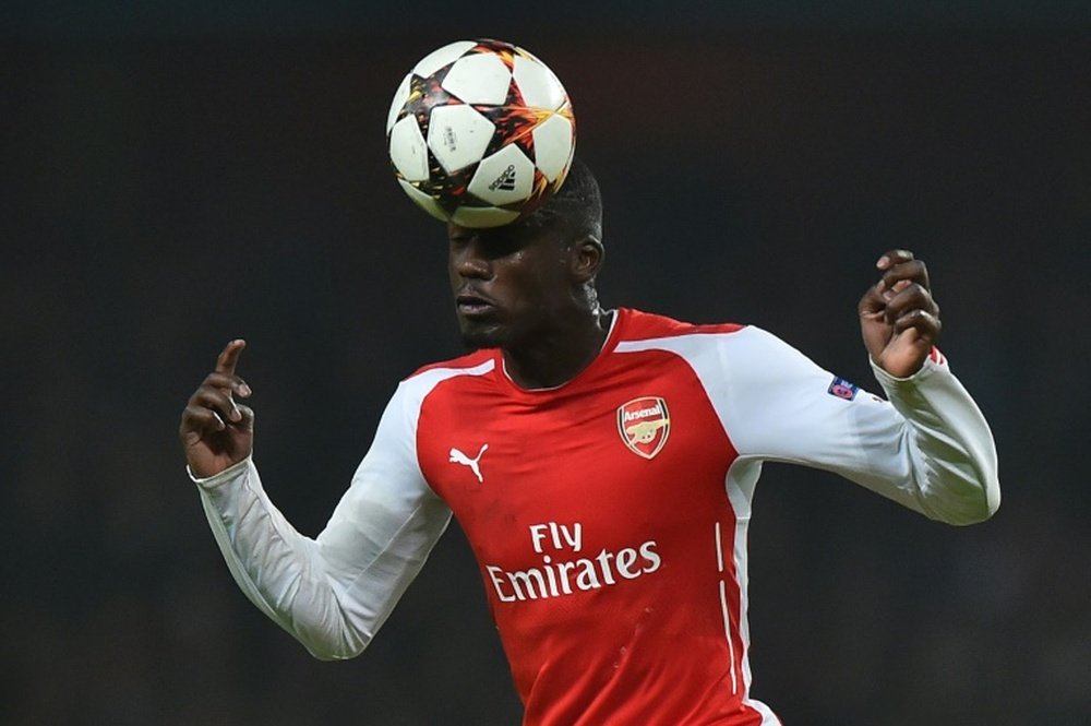 L'attaquant Yaya Sanogo lors d'un match avec Arsenal face au Borussia Dortmund en 2014. AFP