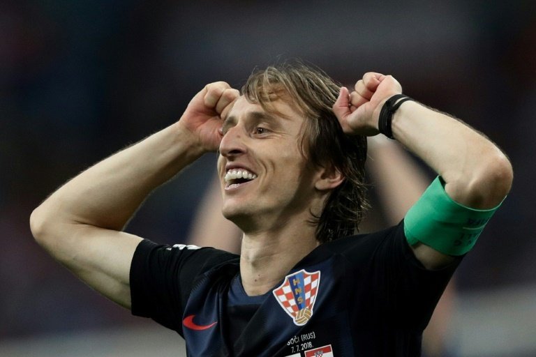 Modric has been honoured with a mural in Kazan, with his face up alongside Messi and Ronaldo. AFP