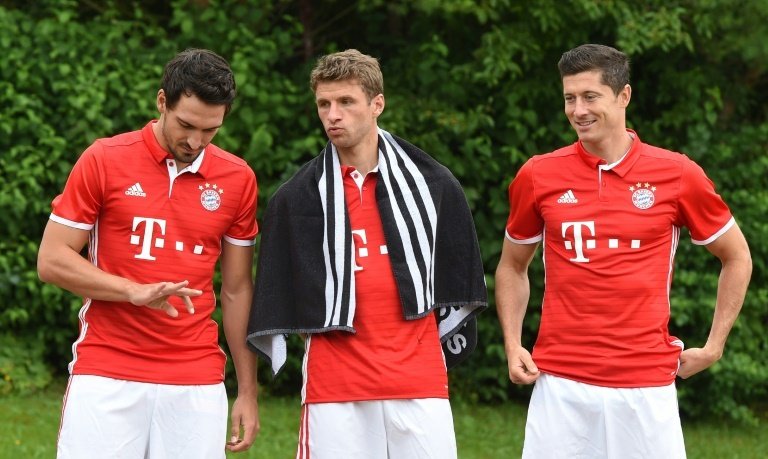 Thomas Muller with his team-mates Lewandowski and Hummels. AFP