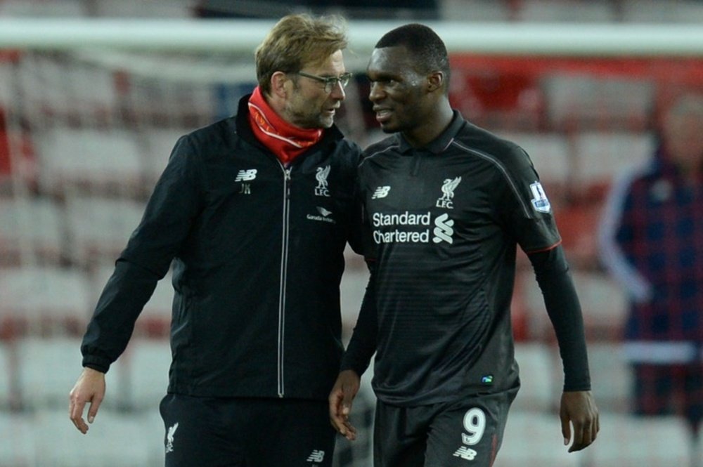 Benteke (R) with manager Jurgen Klopp. AFP