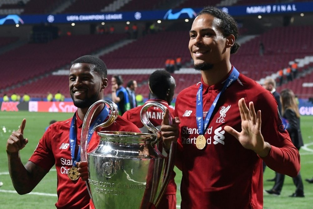 Van Dijk (R) won the Champions League with Liverpool in 2019. AFP