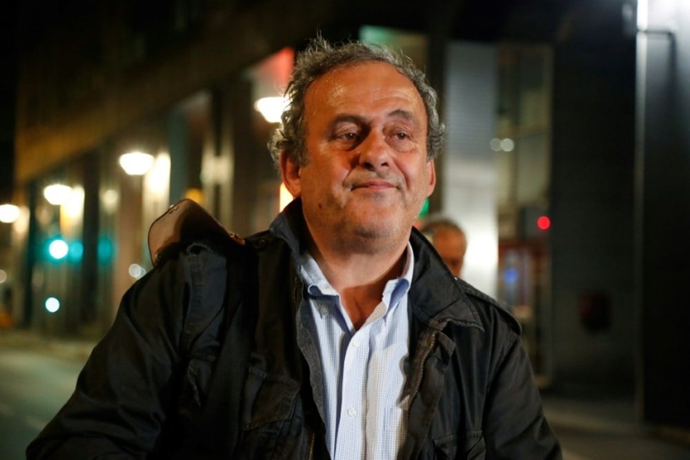 Platini spoke to the press after being released. AFP