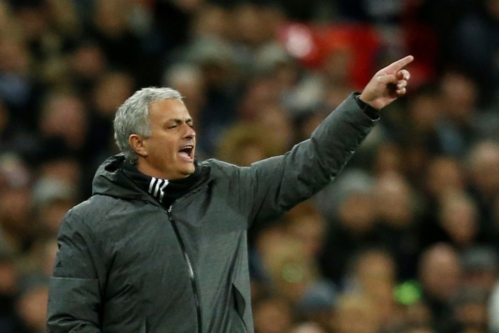 Manchester United fans respond to Mourinho criticism. AFP