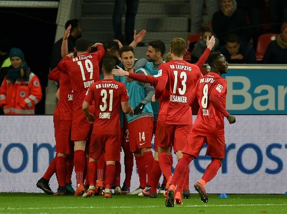 RB Leipzig players celebrate a goal in their 3-2 win over Bayer Leverkusen. AFP
