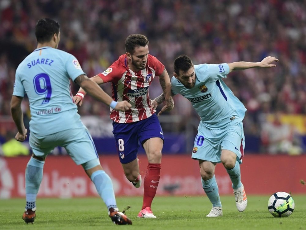 Saúl tiene claro que frenar a Messi es misión imposible. AFP