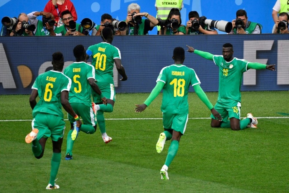 Senegal é a primeira seleção africana a vence neste Mundial. AFP