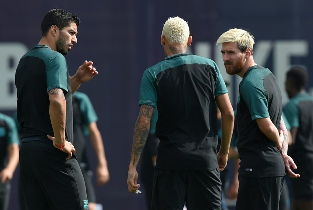Le trio du Barça Luis Suarez, Neymar et Lionel Messi à l'entraînement. AFP