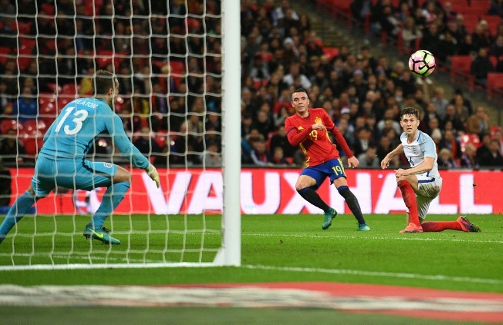 Aspas curls a wonderful effort into the top corner for Spain's first goal of the night. AFP