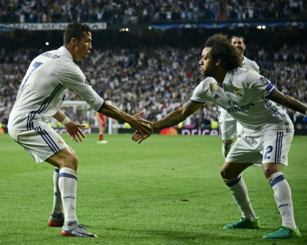 Cristiano y Marcelo comparten una gran amistad en el Real Madrid. AFP