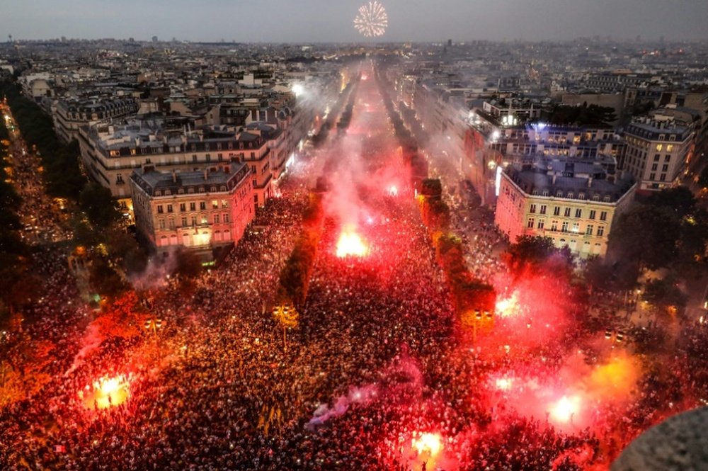 Paris erupted in to celebration on Sunday. AFP