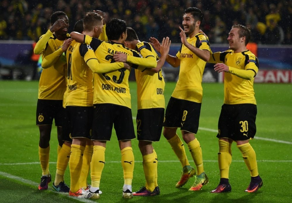 Dortmund players celebrating a goal. AFP