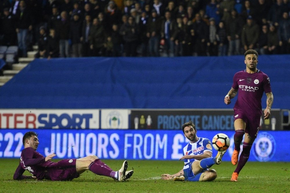 Will Grigg scored the winner. AFP