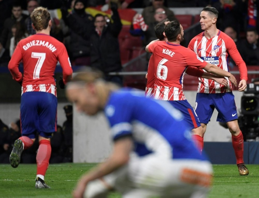 Atletico Madrid sauvé par Fernando Torres (de face). AFP