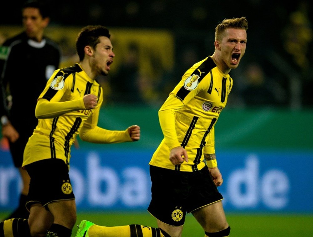 Borussia's Marco Reus is celebrating his team's victory. AFP
