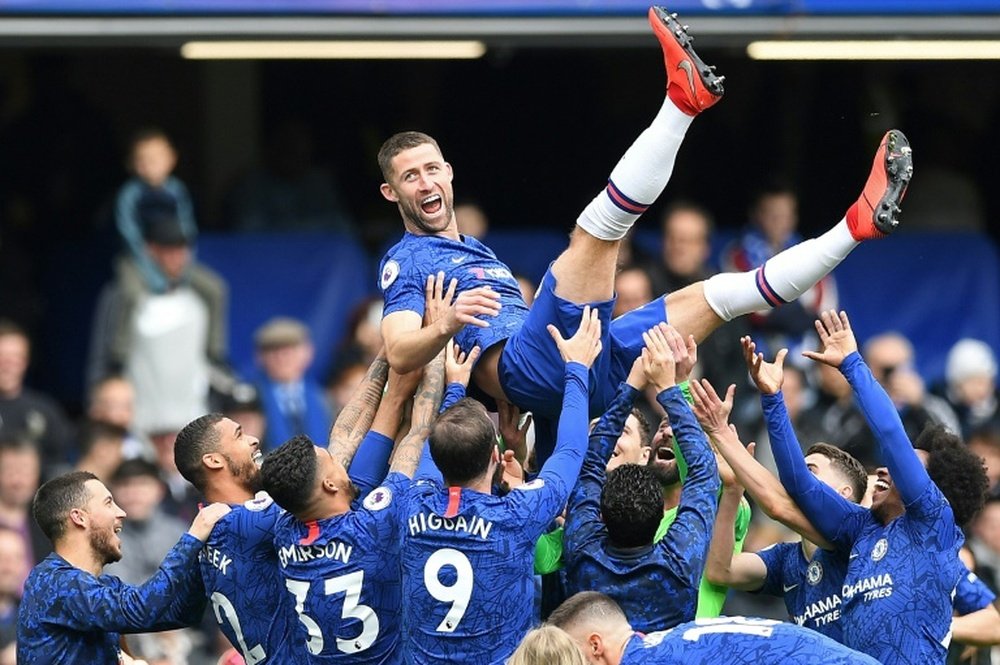 Gary Cahill is held aloft by the Chelsea squad as the defender leaves Chelsea.  AFP