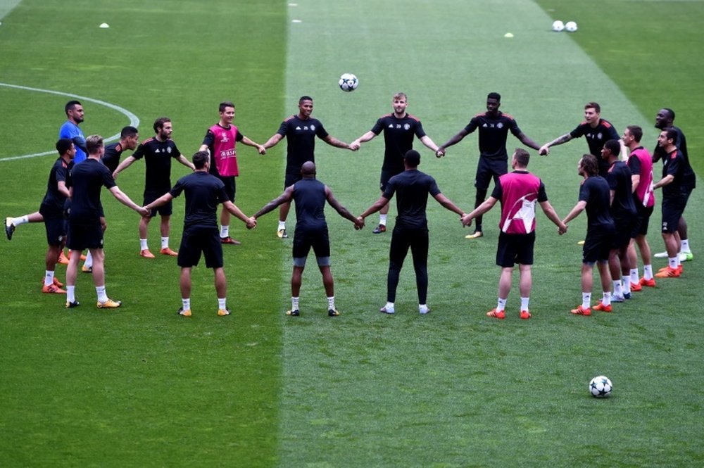 Manchester United players training ahead of their Champions League match against Benfica. AFP