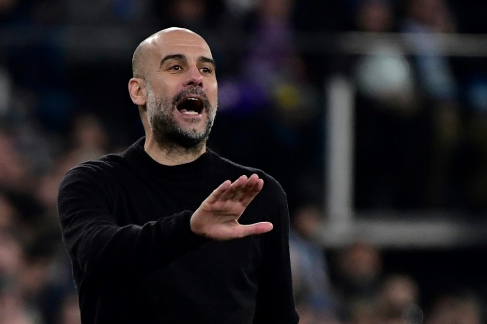 Pep et trois autres entraîneurs devront observer une quarantaine de 14 jours. AFP