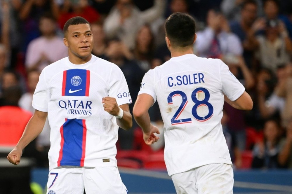 Mbappe takes aim at Soler. AFP