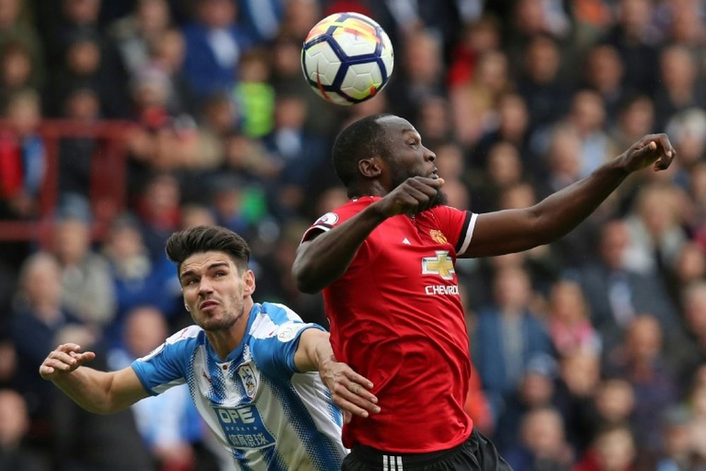 Schindler and Lukaku challenge for the ball. AFP