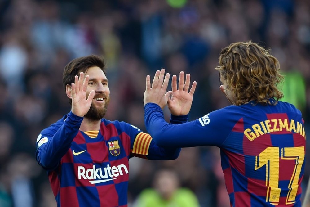Lionel Messi e Antoine Griezmann estão pendurados na Champions League. AFP