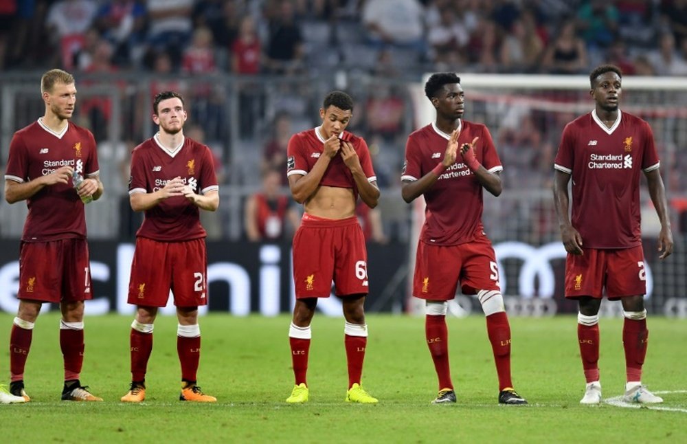 Les joueurs de Liverpool lors d'une séance de tirs au but contre l'Atlético dans la Coupe Audi. AFP