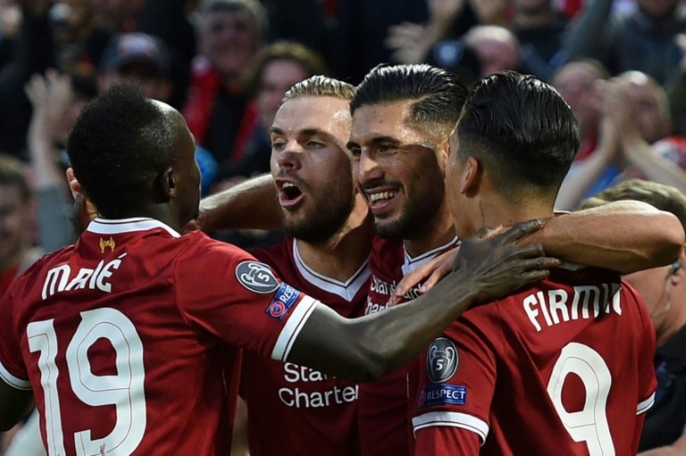Les joueurs de Liverpool se congratulent après un but d'Emre Can face à Hoffenheim. AFP