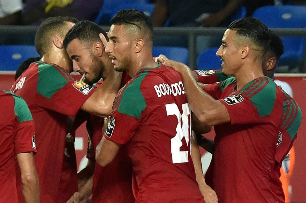 Romain Saisse and team-mates celebrating a goal in the CAF. AFP