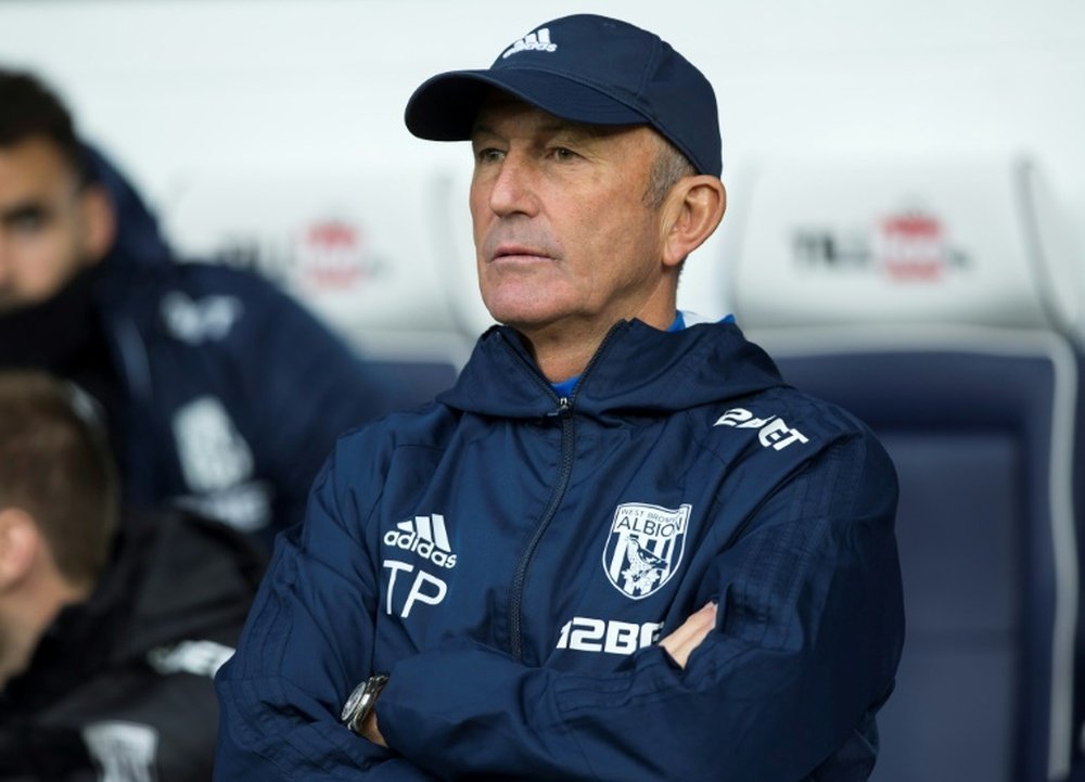 Tony Pulis is possibly lucky to be alive after Dave Kitson attacked him. AFP