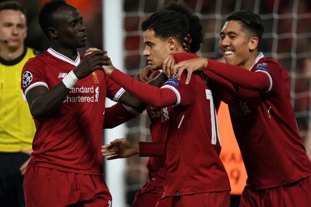 Firmino echa de menos a Coutinho. AFP