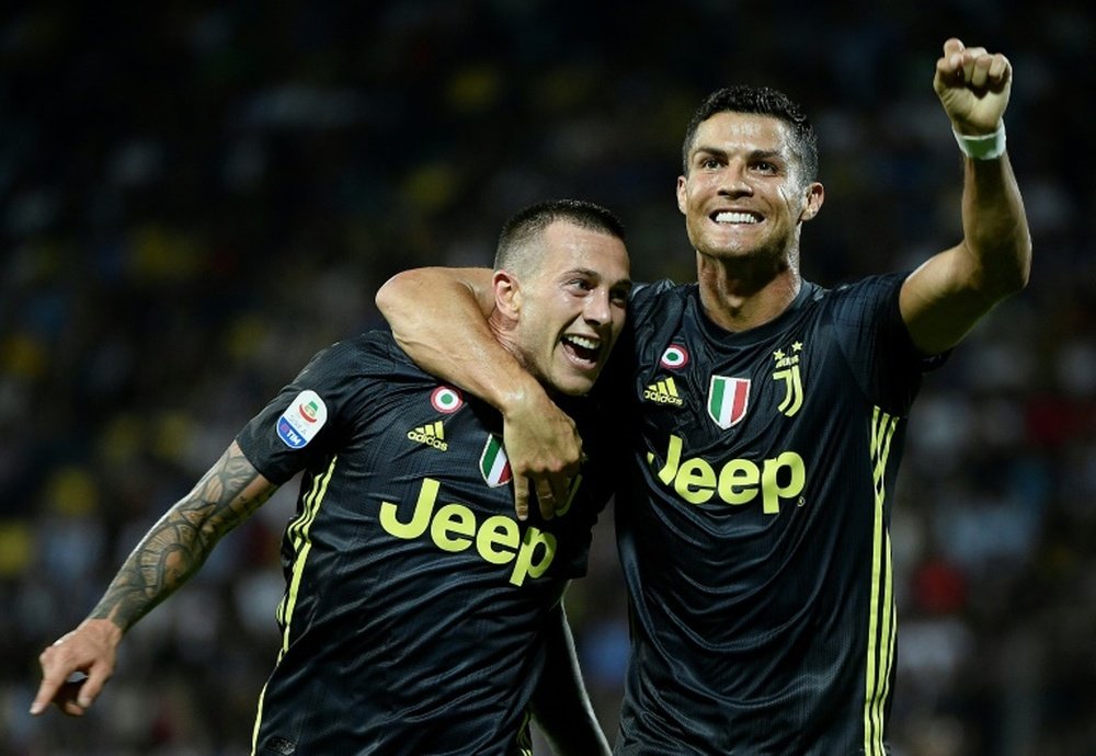 Federico Bernardeschi et Cristiano Ronaldo. AFP