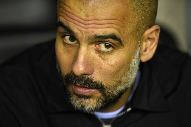 Guardiola: Premier League title close but not done. AFP