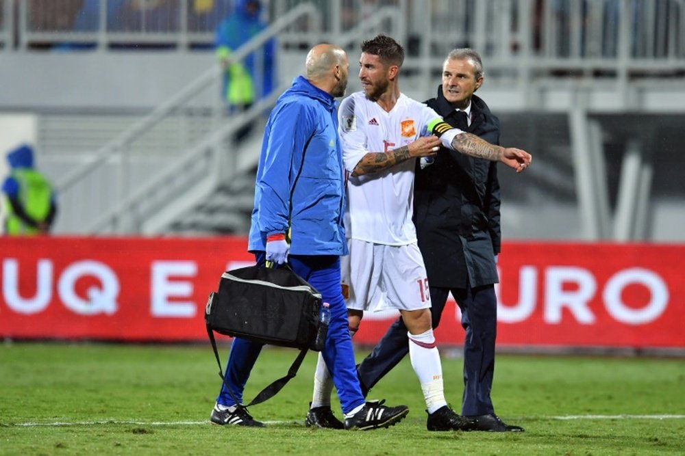 Ramos leaves the field after being injured against Albania. AFP